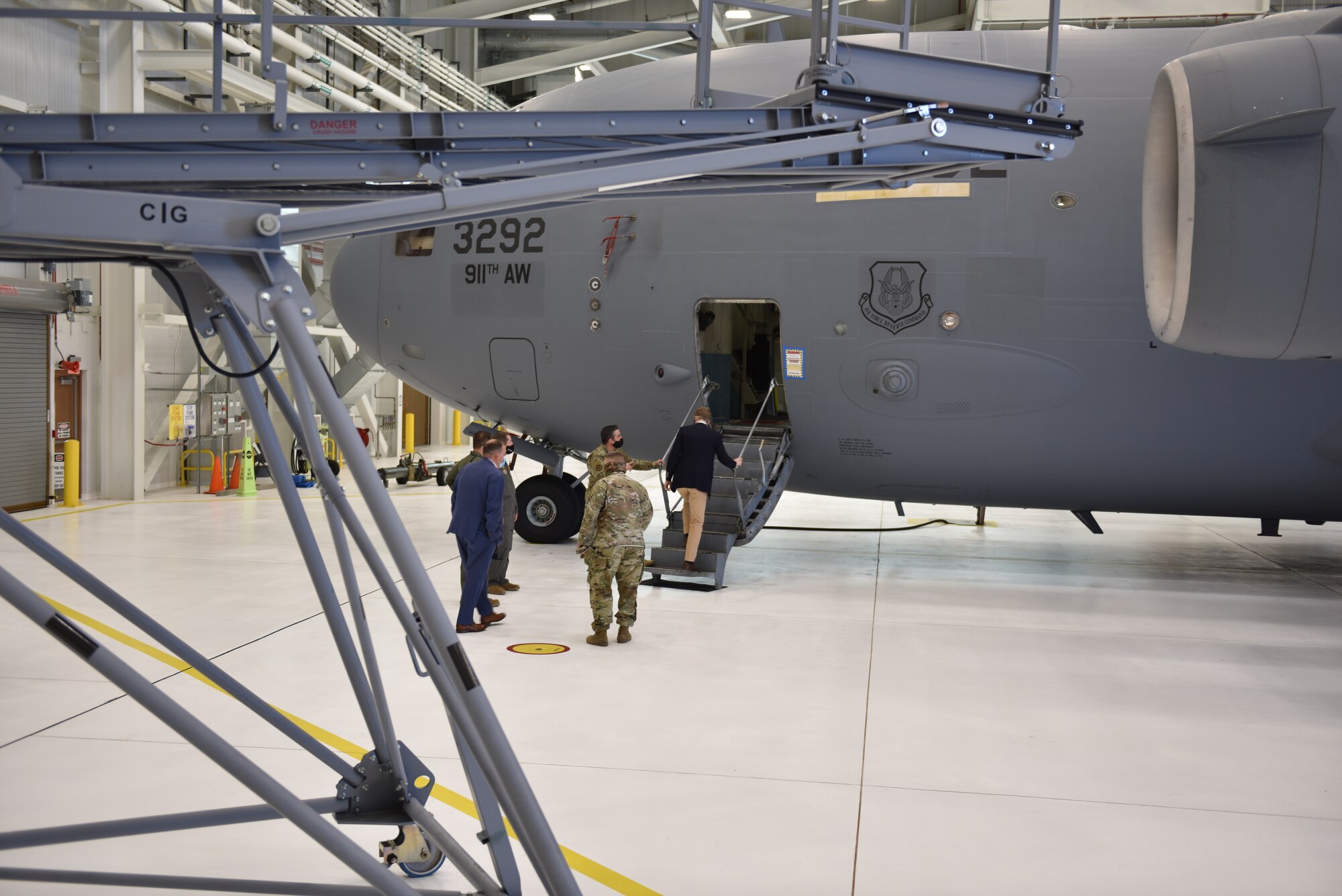 U.S. Rep. Conor Lamb, of Pennsylvania's 17th district, walks up the forward staircase of a C-17 Globemaster III while on a congressional visit at the Pittsburgh International Airport Air Reserve Station, April 26, 2021.