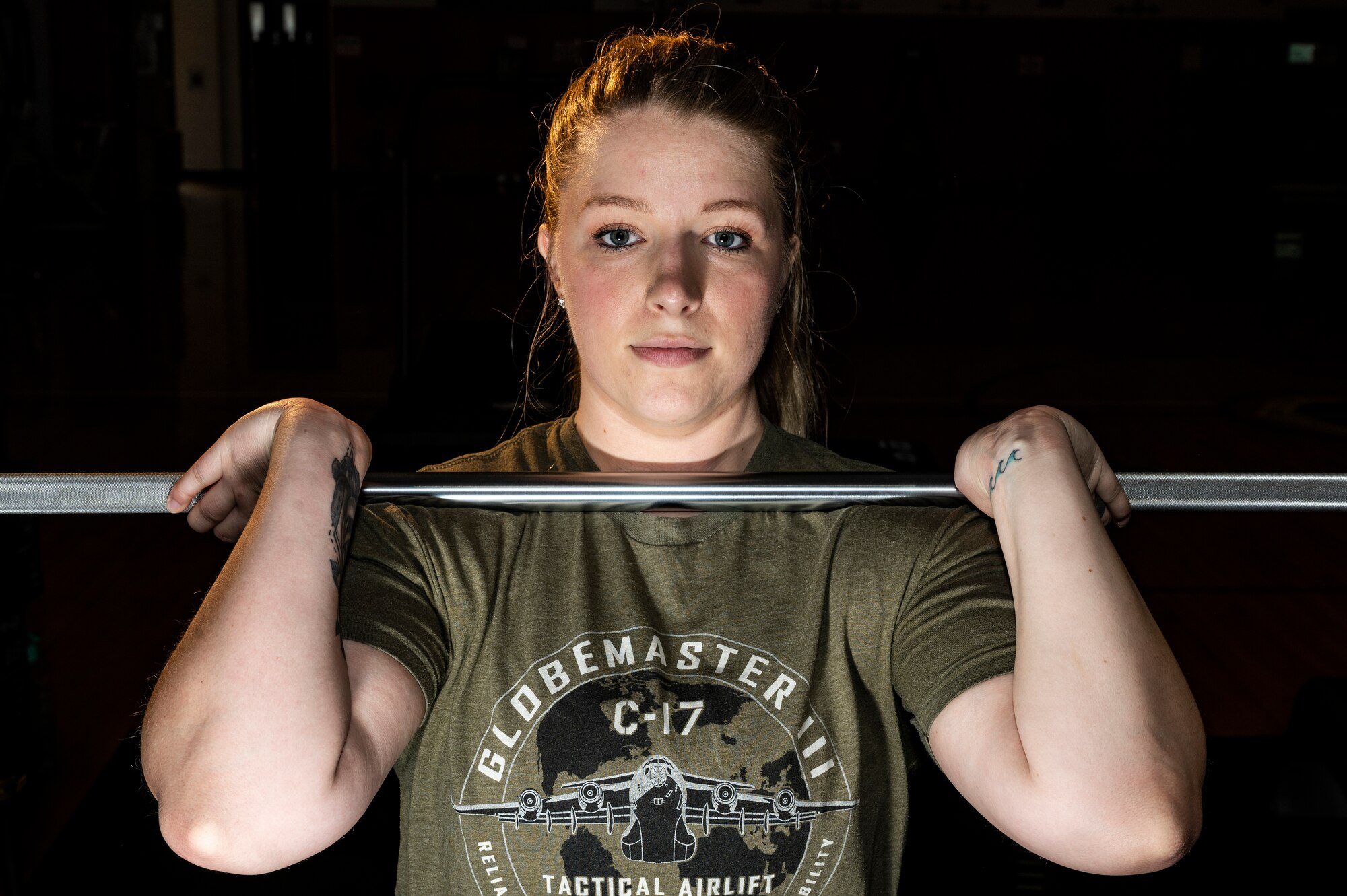 Senior Airman Sarah Hargis, 911th Logistics Readiness Squadron commander’s support staff member, holds a pose while demonstrating an Olympic-style weightlifting technique called “power clean” at the Pittsburgh International Airport Air Reserve Station, Pennsylvania, April 11, 2021.