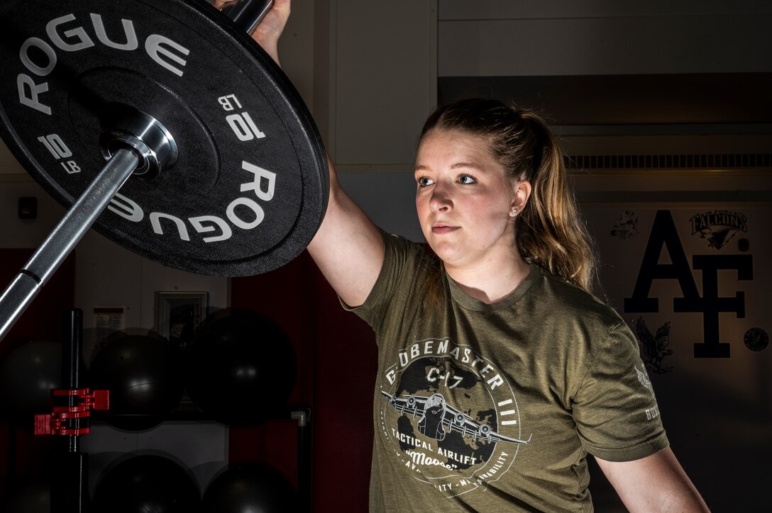 Senior Airman Sarah Hargis, 911th Logistics Readiness Squadron commander’s support staff member, practices an Olympic style-weightlifting fitness technique called “land mine” at the Pittsburgh International Airport Air Reserve Station, Pennsylvania, April 11, 2021.