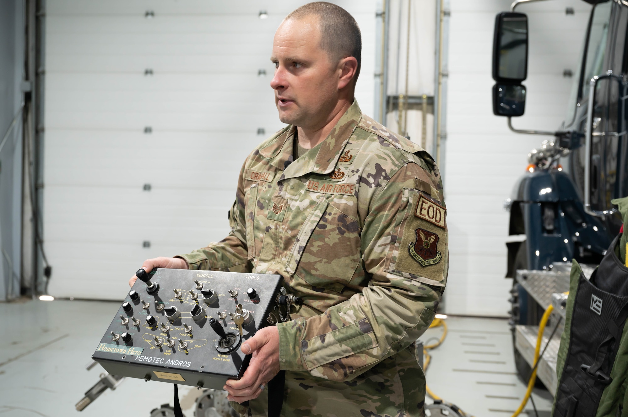 Tech. Sgt. Tristan Crandall, 341st Civil Engineer Squadron explosives ordnance disposal noncommissioned officer in charge of equipment, explains how the old robot remote control used to work June 2, 2021, at Malmstrom Air Force Base, Mont.
