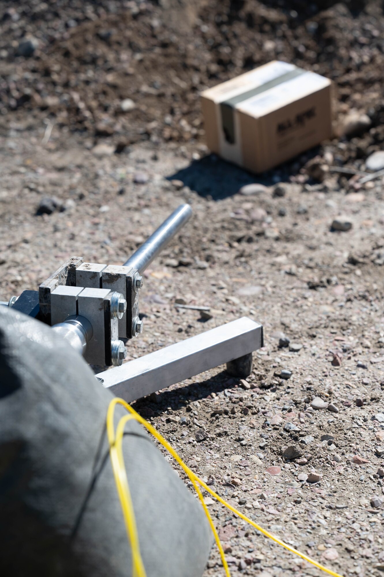 Members of the 341st Civil Engineer Squadron explosive ordnance disposal team use the pictured remote-fired shotgun to shoot through a cardboard box during a training demonstration June 2, 2021, at Malmstrom Air Force Base, Mont.