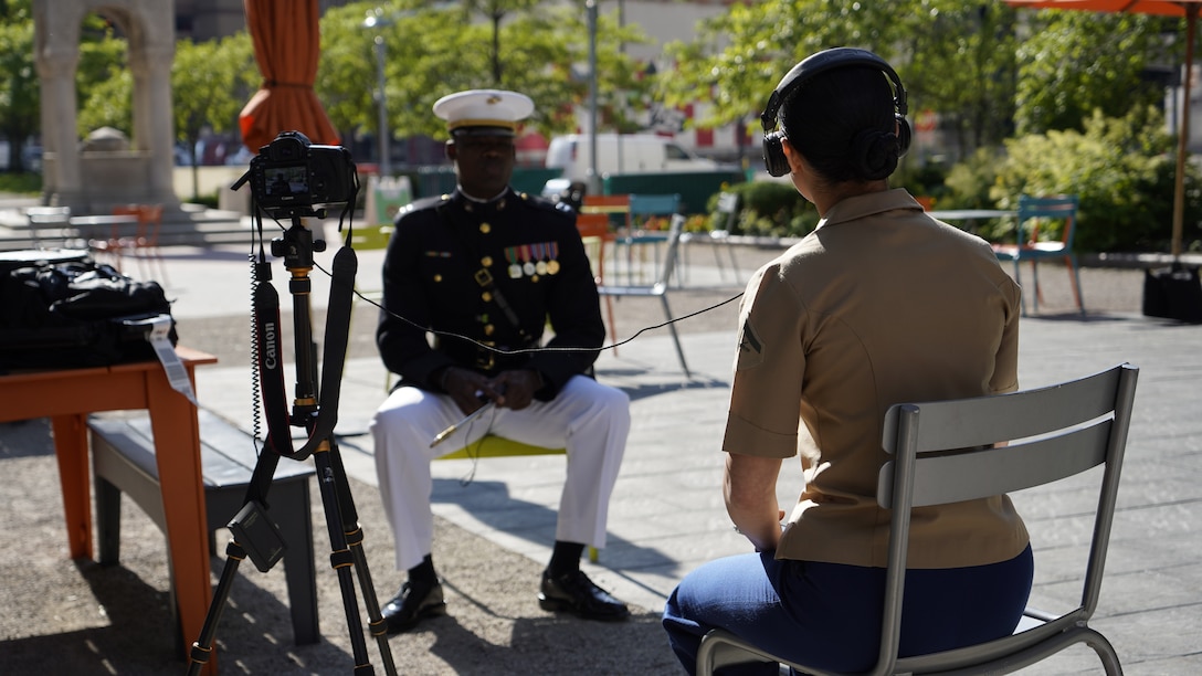 Capt. Isaac Seals, the U.S. Marine Corps Silent Drill Platoon, Platoon Commander,  is interviewed by the local COMMSTRAT and local news outlets after the platoon's performance in Detroit, Michigan, in support of Recruiting Station (RS) Cleveland and RS Lansing, June 1, 2021. After each performance the platoon conducted a meet and greet with the audiences, poolees and recruiters. (U.S. Marine Corps photo by Sgt. Jason A. Kolela)