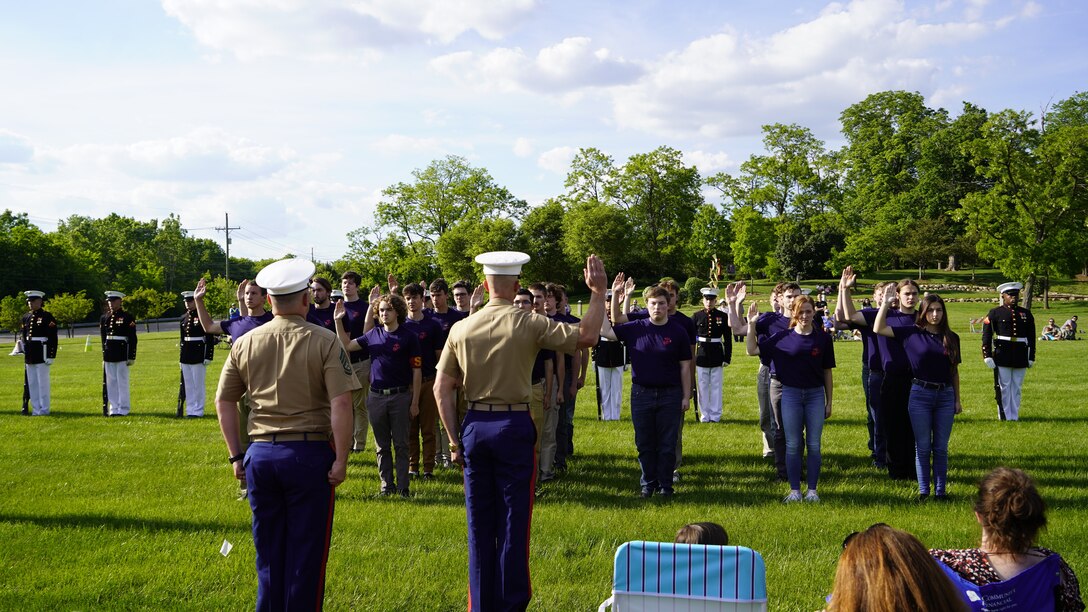 During the U.S. Marine Corps Silent Drill Platoon's last show of the day the poolees of RS Lancing formed up in front of the platoon and conducted a swearing in ceremony, June 1, 2021. This once in a lifetime opportunity cemented their commitment to the Marine Corps and our nation. (U.S. Marine Corps photo by Sgt. Jason A. Kolela.