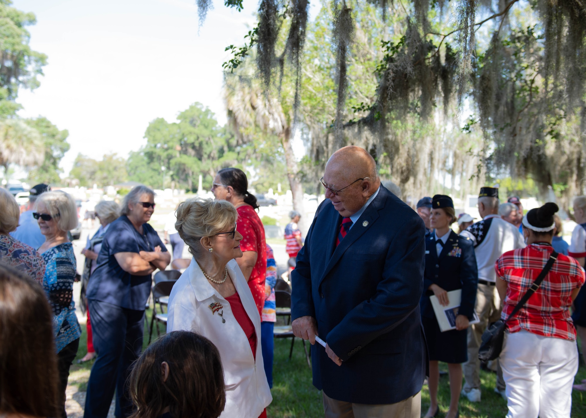 A photo of Dr. Lucy speaking with a community leader.