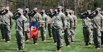 Soldiers assigned to Headquarters Company, 86th Infantry Brigade Combat Team (Mountain), Vermont National Guard, salute during their deployment ceremony at Camp Ethan Allen Firing Range, Jericho, Vermont, May 14, 2021. Family and friends gathered to support the Soldiers during the ceremony. (U.S. Army National Guard photo by Joshua T. Cohen)