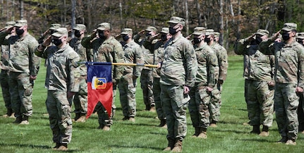 Soldiers assigned to Headquarters Company, 86th Infantry Brigade Combat Team (Mountain), Vermont National Guard, salute during their deployment ceremony at Camp Ethan Allen Firing Range, Jericho, Vermont, May 14, 2021. Family and friends gathered to support the Soldiers during the ceremony. (U.S. Army National Guard photo by Joshua T. Cohen)