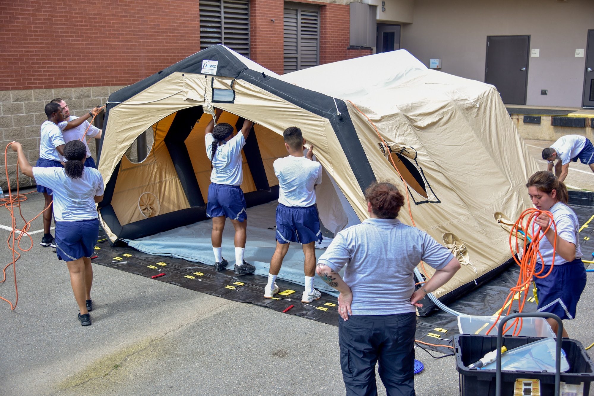 Airmen put up a tent during medical training