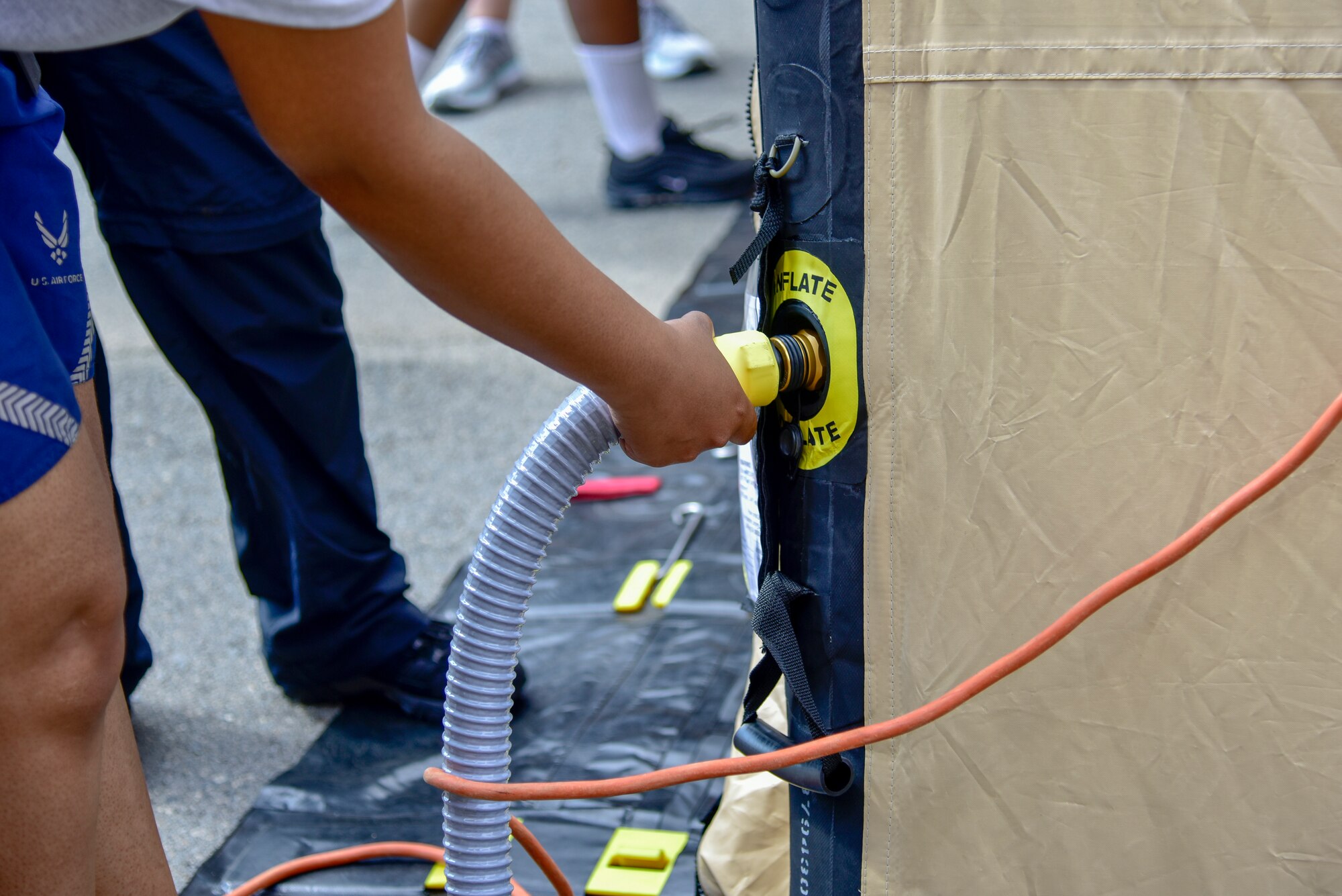 A tent is inflated during patient decontamination training