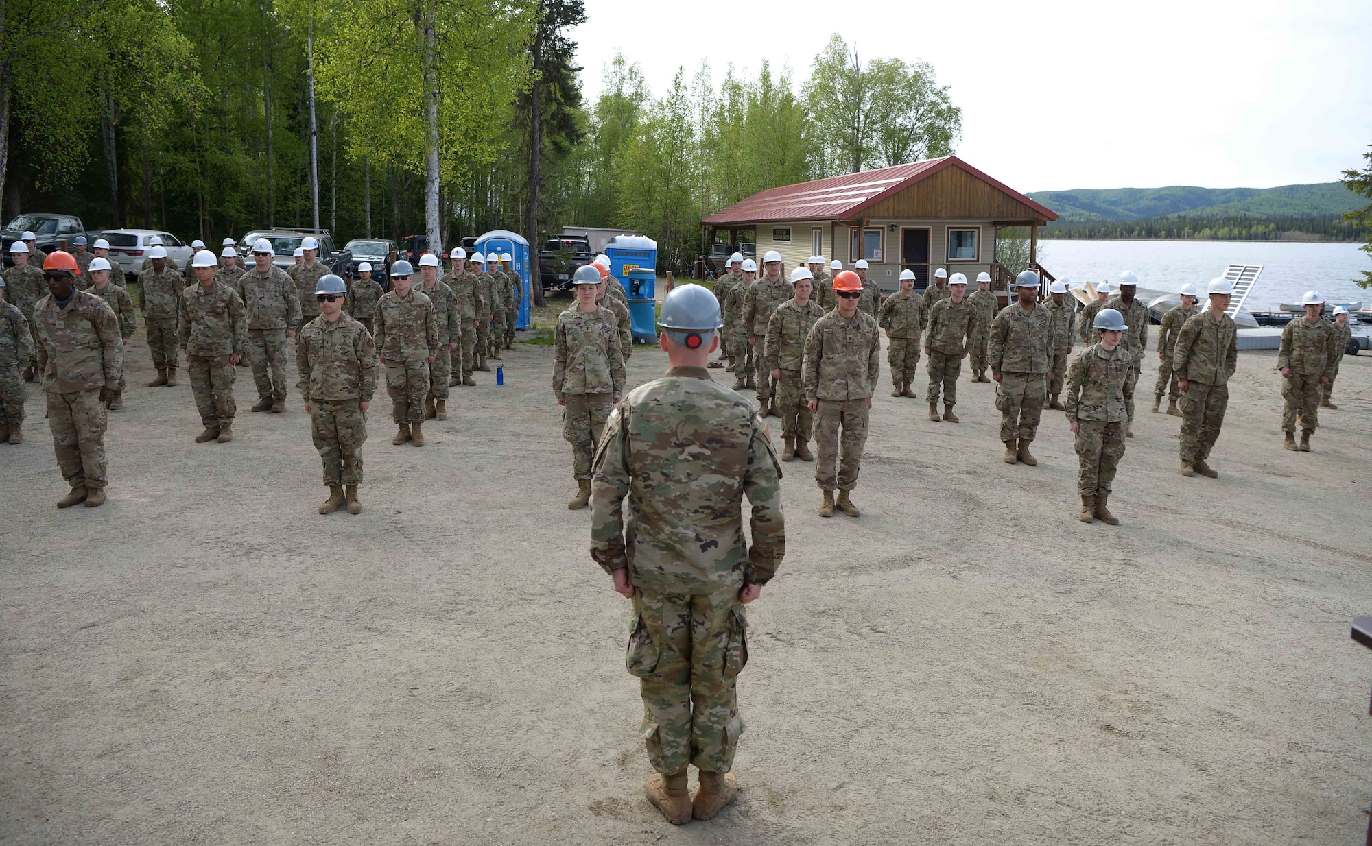 U.S. Air Force Lt. Col. Nicholas Van Elsacker, the 354th CES commander, takes charge of approximately 135 Airmen during a troop training project May 26, 2021, at the Birch Lake Military Recreation Area, Alaska. With such a successful turnout and results, the leaders of the 354th CES are looking at continuing to upgrade the recreation area little by little each year. (U.S. Air Force photo by Senior Airman Beaux Hebert)