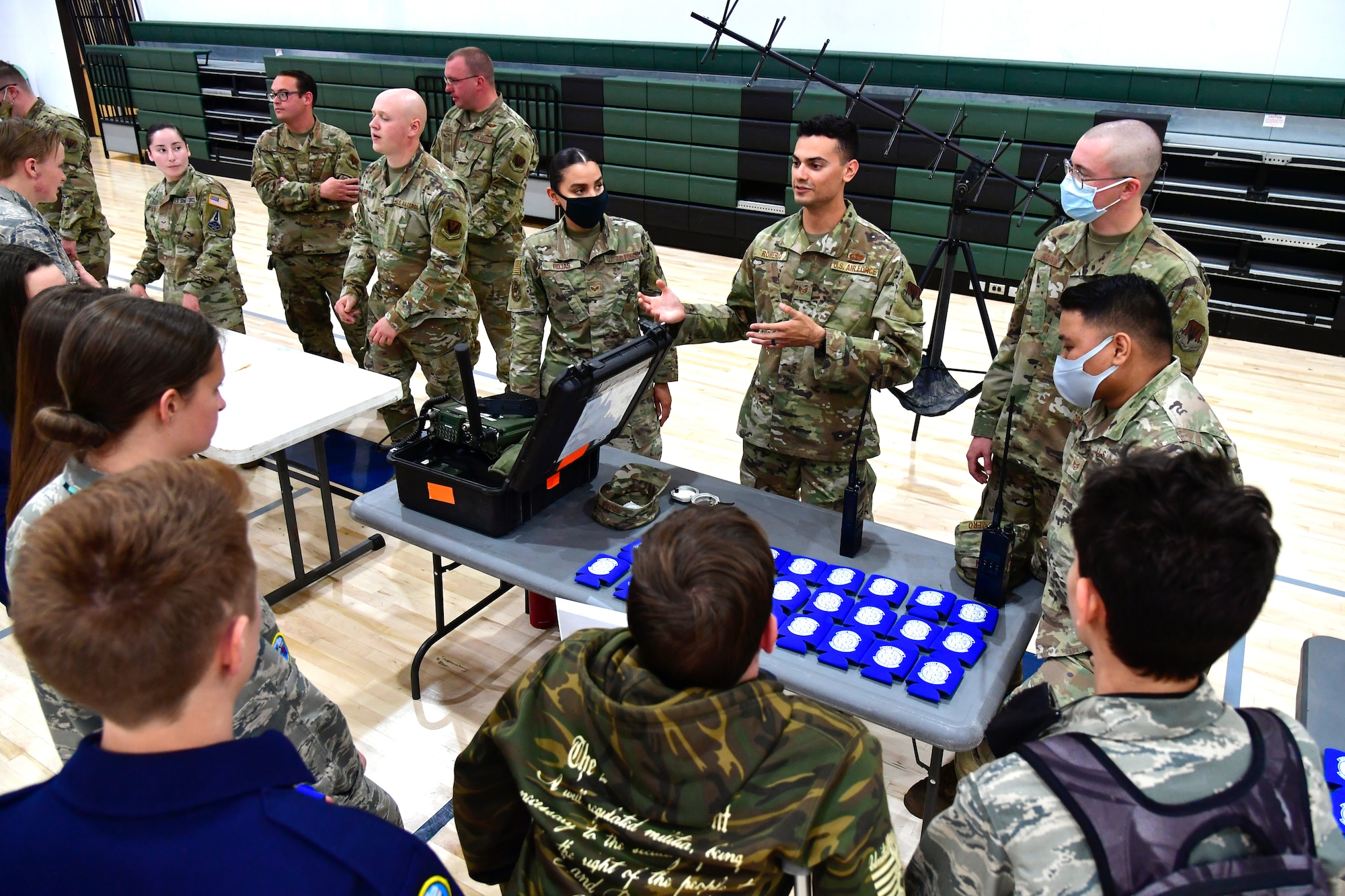 Staff Sgt. Matthew Romero, 729th Air Control Squadron, speaks with students while participating in a job fair at the Utah Military Academy, May 25, 2021, in Riverdale, Utah. Airmen from Hill Air Force Base recently hosted the event at the nearby charter high school to educate and inspire students, as well as promote interest in the possibility of future military careers. (U.S. Air Force photo by Todd Cromar)