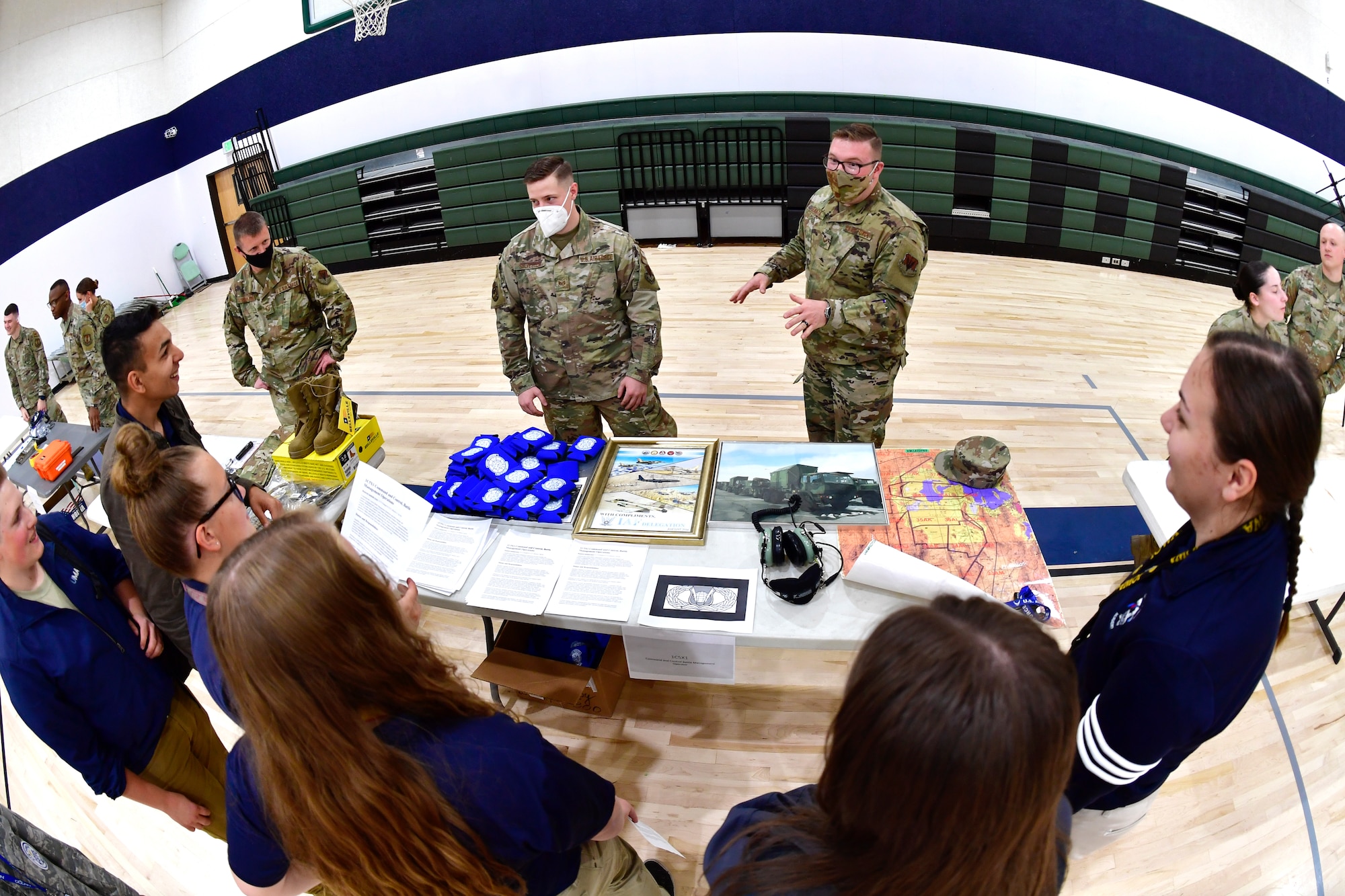 Senior Airman Nicolas Geanta, 729th Air Control Squadron, speaks with students while participating in a job fair at the Utah Military Academy, May 25, 2021, in Riverdale, Utah. Airmen from Hill Air Force Base recently hosted the event at the nearby charter high school to educate and inspire students, as well as promote interest in the possibility of future military careers. (U.S. Air Force photo by Todd Cromar)