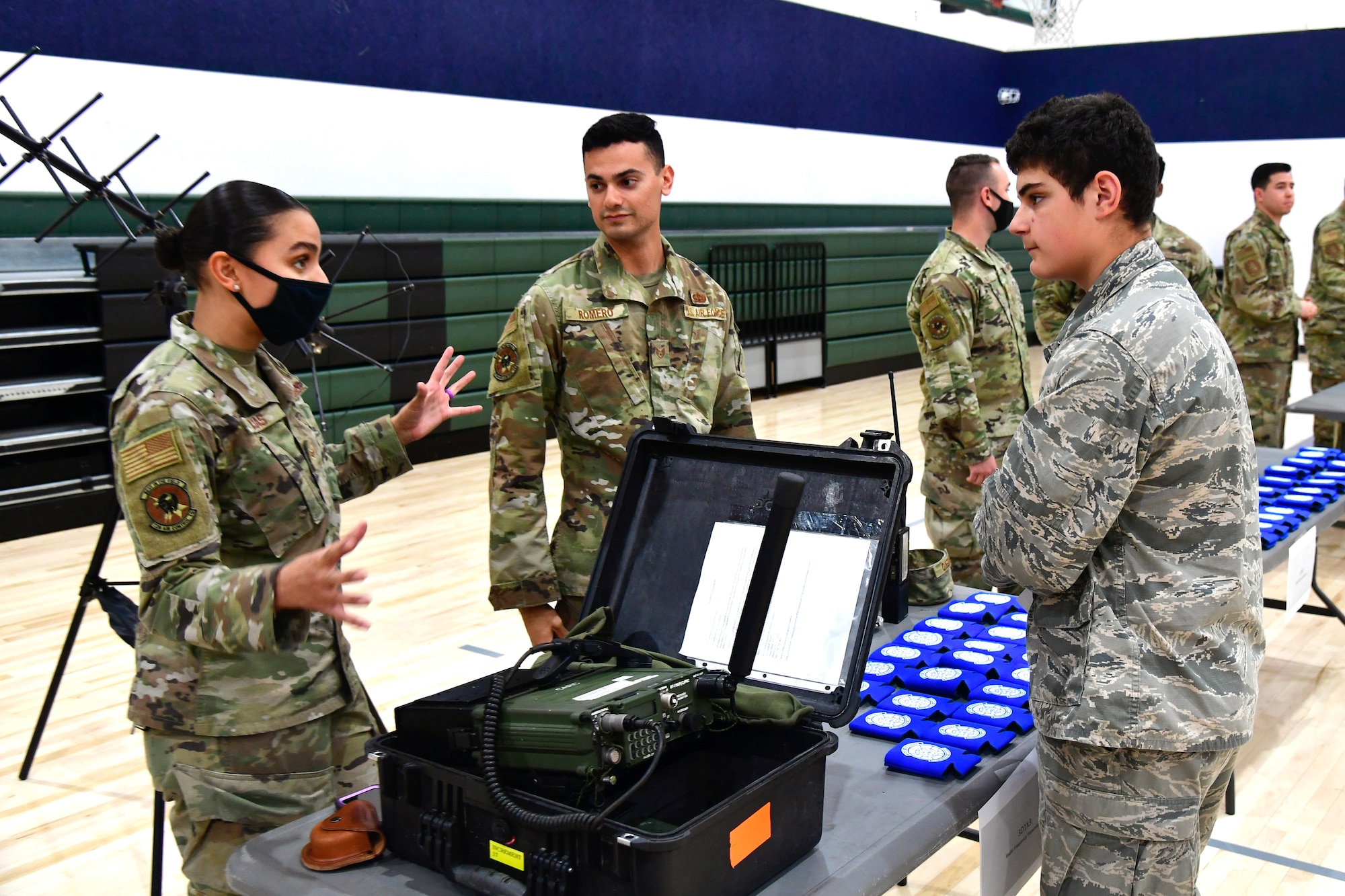 Senior Airman Laura Rojas, 729th Air Control Squadron, speaks with a student while participating in a job fair at the Utah Military Academy, May 25, 2021, in Riverdale, Utah. Airmen from Hill Air Force Base recently hosted the event at the nearby charter high school to educate and inspire students, as well as promote interest in the possibility of future military careers. (U.S. Air Force photo by Todd Cromar)