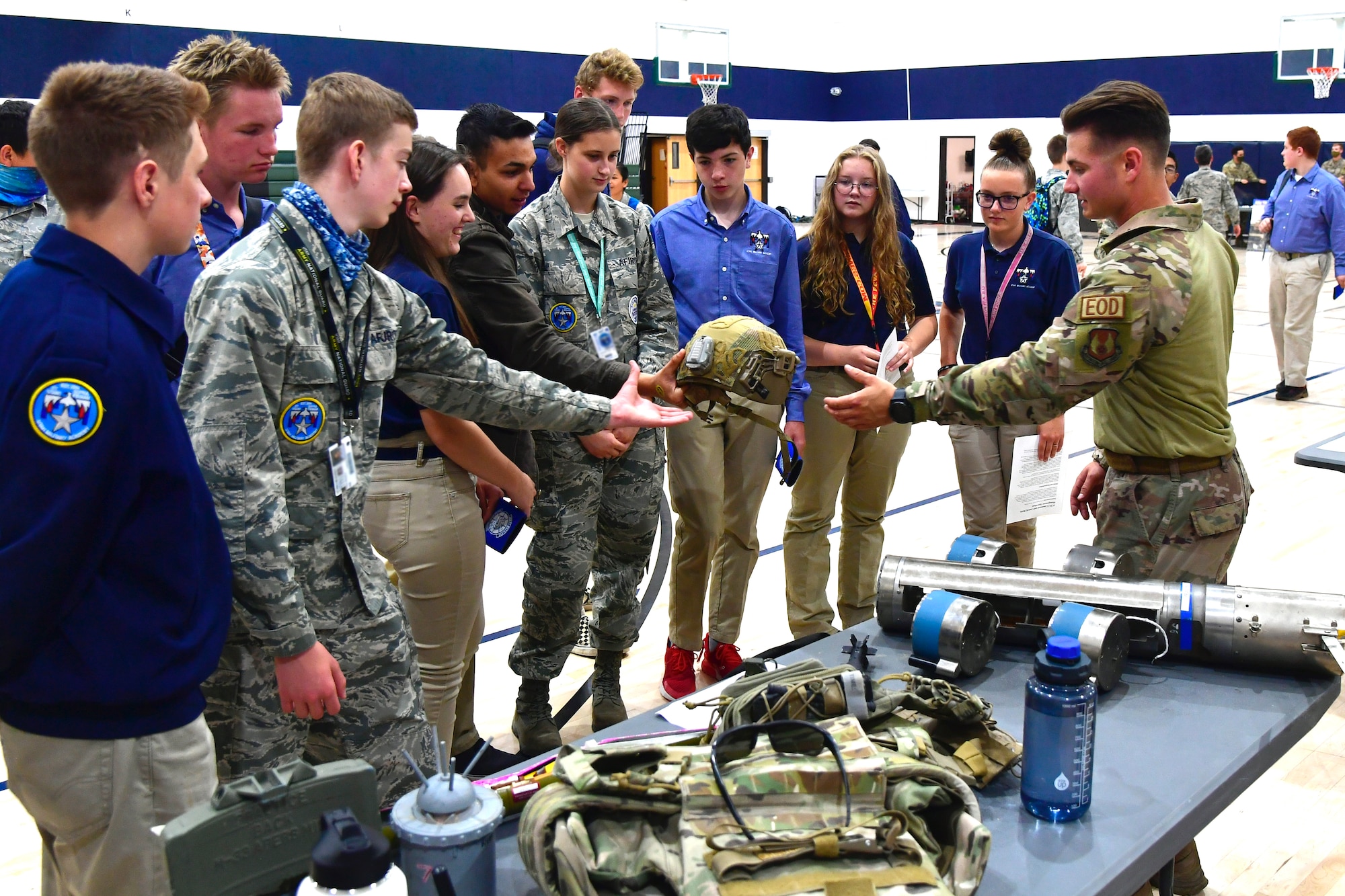 Airman First Class William Galuszka, 775th Civil Engineering Squadron, speaks with students about military equipment during a job fair at the Utah Military Academy, May 25, 2021, in Riverdale Utah. Airmen from Hill Air Force Base recently hosted the event at the nearby charter high school to educate and inspire students, as well as promote interest in the possibility of future military careers. (U.S. Air Force photo by Todd Cromar)