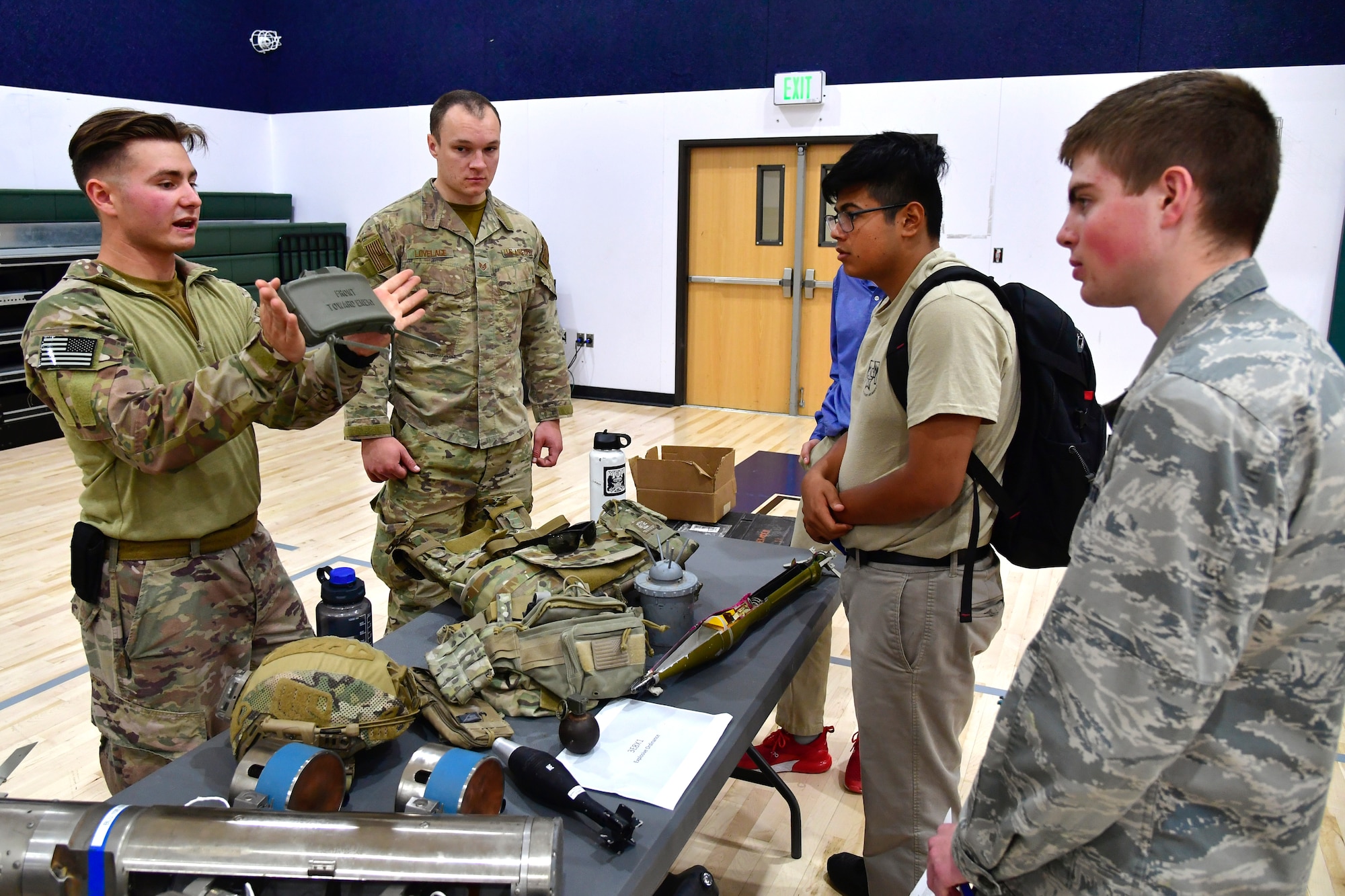 Airman First Class William Galuszka, 775th Civil Engineering Squadron, speaks with students about explosive devices while participating in a job fair at the Utah Military Academy, May 25, 2021, in Riverdale Utah. Airmen from Hill Air Force Base recently hosted the event at the nearby charter high school to educate and inspire students, as well as promote interest in the possibility of future military careers. (U.S. Air Force photo by Todd Cromar)