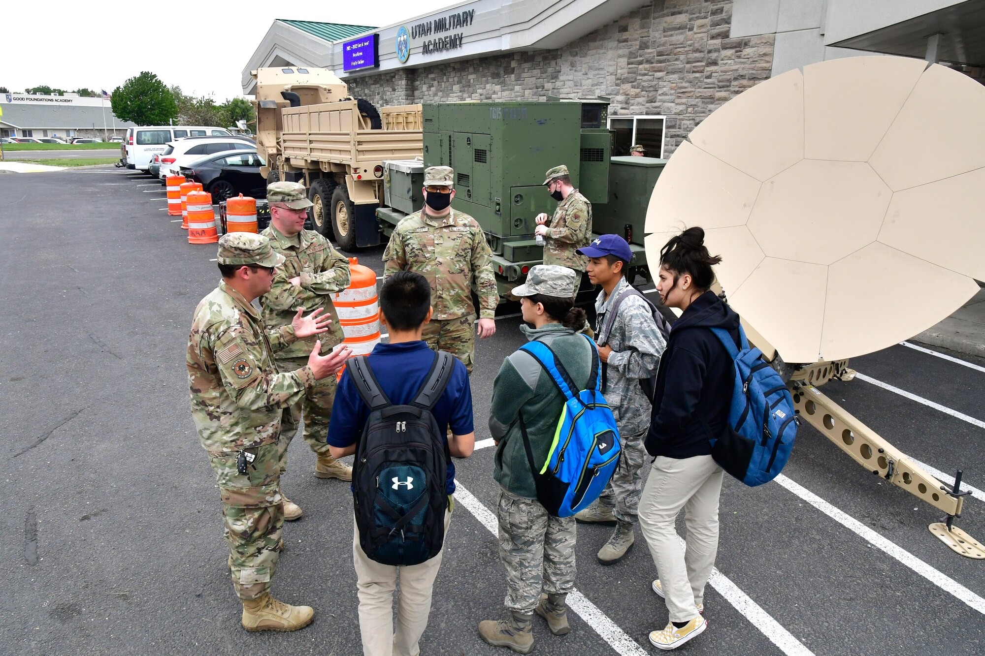 Staff Sgt. Anthony Bauc, 729th Air Control Squadron, discusses mobile radar equipment with students during a job fair at the Utah Military Academy, May 25, 2021, in Riverdale, Utah. Airmen from Hill Air Force Base recently hosted the event at the nearby charter high school to educate and inspire students, as well as promote interest in the possibility of future military careers. (U.S. Air Force photo by Todd Cromar)