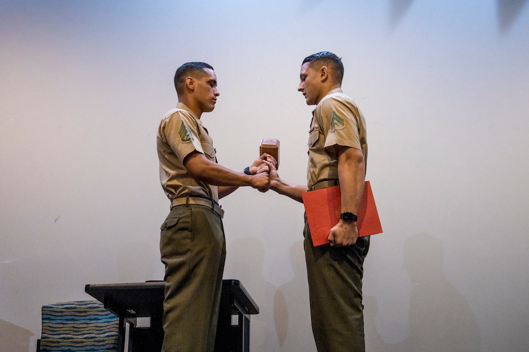 Marines with Headquarters and Headquarters Squadron graduate Martial Arts Instructor Course 166-21 at Marine Corps Air Station Yuma, Ariz. May 27, 2021. )