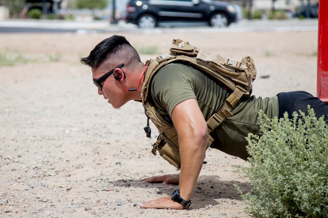 U.S. Marine Corps 2nd Lt. Thorsen Hsu, a PMO officer with Headquarters & Headquarters Squadron (H&HS), Marine Corps Air Station (MCAS) Yuma, performs pushups as a part of a squadron MURPH challenge on MCAS Yuma, Ariz., May 26, 2021.