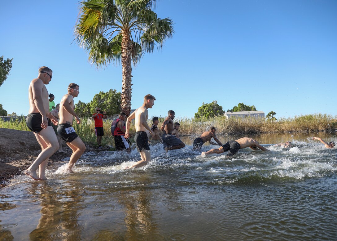 U.S. Marines with Headquarters and Headquarters Squadron (H&HS) compete in a squadron competition at Lake Martinez, Ariz., May 28, 2021. The competition consisted of a triathlon style challenge as a way of improving morale and comradery through competition between the different sections of H&HS. (U.S. Marine Corps photo by Sgt. Jason Monty)
