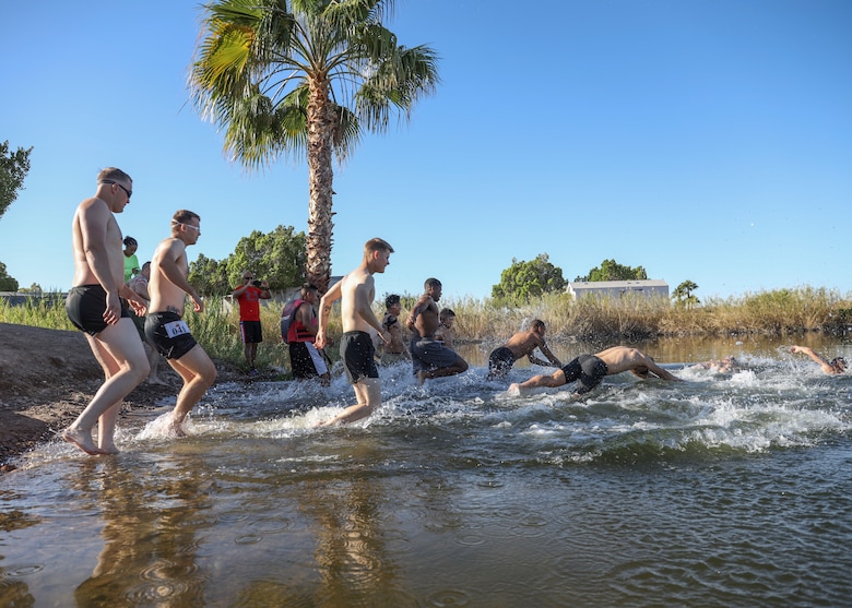 U.S. Marines with Headquarters and Headquarters Squadron (H&HS) compete in a squadron competition at Lake Martinez, Ariz., May 28, 2021. The competition consisted of a triathlon style challenge as a way of improving morale and comradery through competition between the different sections of H&HS. (U.S. Marine Corps photo by Sgt. Jason Monty)