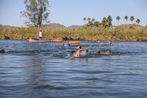 U.S. Marines with Headquarters and Headquarters Squadron (H&HS) compete in a squadron competition at Lake Martinez, Ariz., May 28, 2021. The competition consisted of a triathlon style challenge as a way of improving morale and comradery through competition between the different sections of H&HS. (U.S. Marine Corps photo by Sgt. Jason Monty)