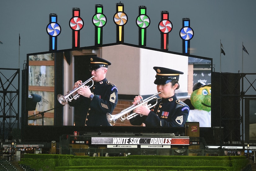 Master Sgt. Ward Yager (left) and Staff Sgt. Tiffany Hoffer, with the United States Army Field Band Brass Quintet, perform in Chicago, May 28, 2021 for Memorial Day weekend at the Chicago White Sox home game versus the Baltimore Orioles.