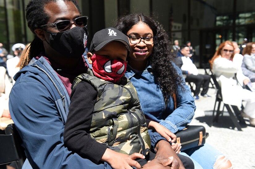 Four-year-old Joseph Lowery Junior with his Father, Joseph and mother, Martina, of Chicago take part in the Chicago Memorial Day ceremony at Daley Plaza, May 29, 2021.