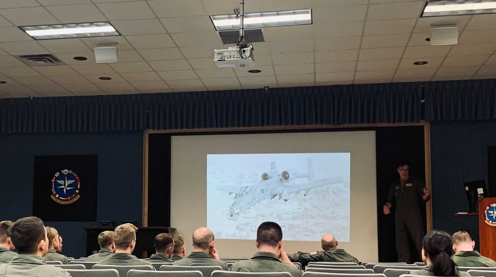 A photo of Airmen being briefed