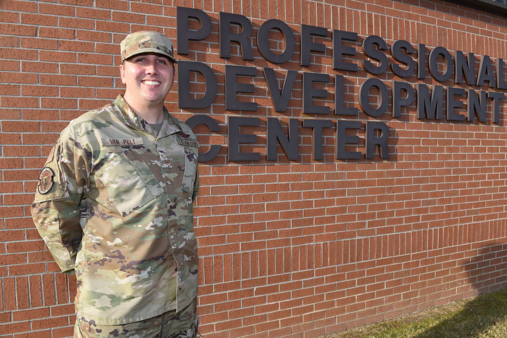 man standing in front of sign