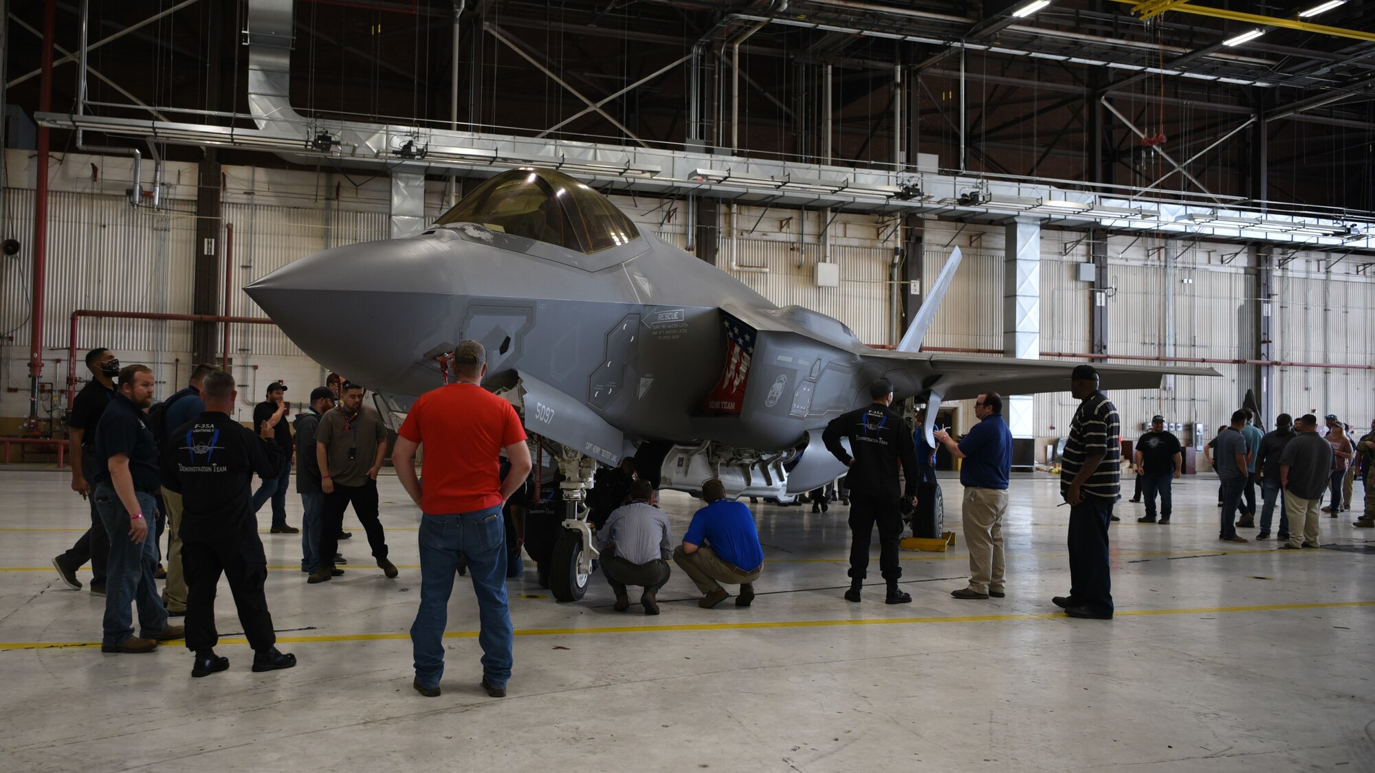 Group of people looking at an aircraft.