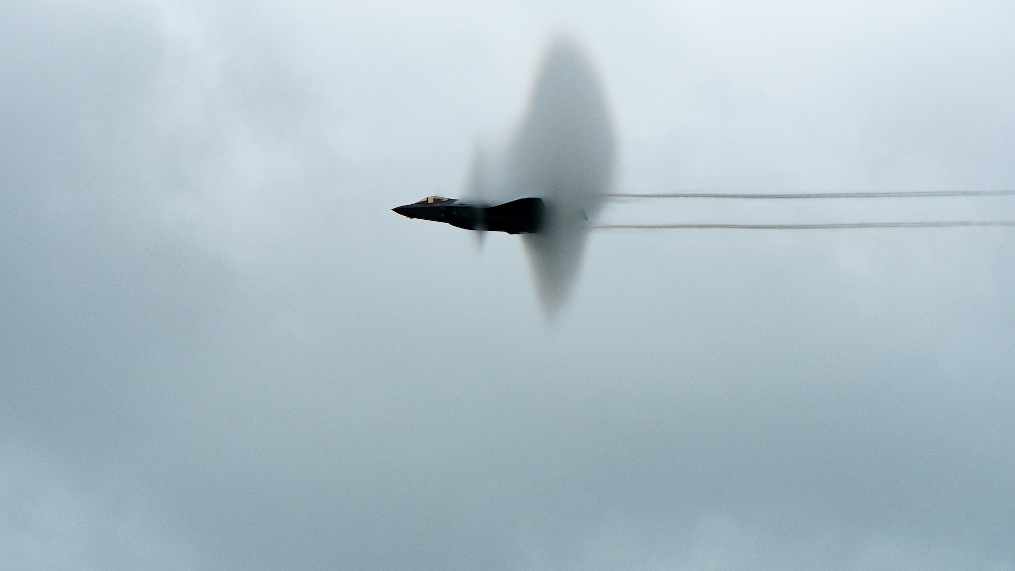 aircraft flying through vapor ring