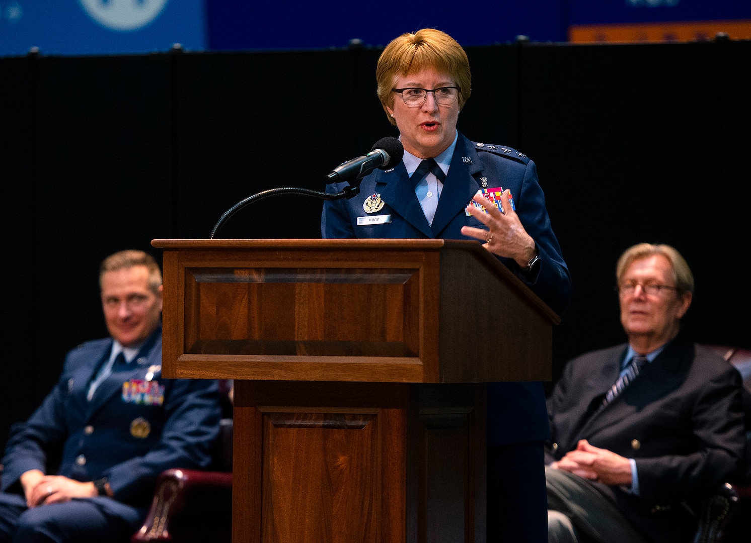Air Force Lt. Gen. Dorothy Hogg, Air Force surgeon general, gives the graduation address at the Wright-Patterson Medical and Allied Health Education Programs graduation ceremony May 27, 2021, in the National Museum of the U.S. Air Force as Col. Christian Lyons, 88th Medical Group commander, and Albert Painter, dean of the Wright State University Boonshoft School of Medicine, looks on. More than 70 Air Force officers were recognized for completing their medical residencies in local hospitals including the Wright-Patterson Air Force Base, Ohio, Medical Center and the Dayton Veterans Affairs Medical Center. (U.S. Air Force photo by R.J. Oriez)