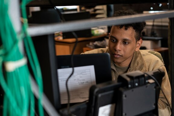 U.S. Air Force Airman 1st Class Xeryus Lee, 48th Communications Squadron client systems technician, troubleshoots computer equipment at Royal Air Force Lakenheath, England, May 25, 2021. The 48th CS won the Lt. Gen. Harold W. Grant Award for best small communications squadron in the U.S. Air Force for the Oct. 1, 2019 to Sept. 30, 2020 time period. (U.S. Air Force photo by Senior Airman Jessi Monte)