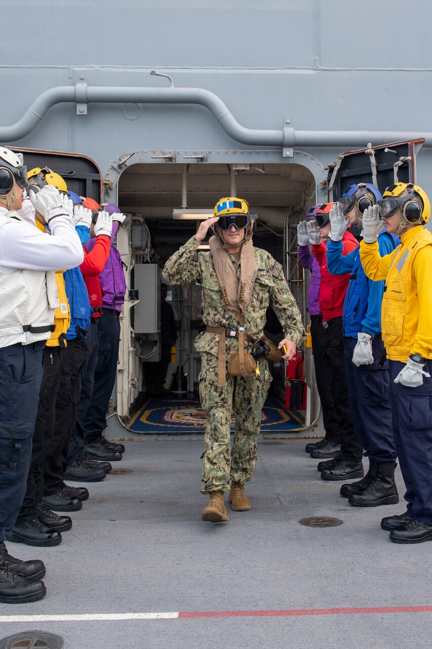 PHILIPPINE SEA (June 2, 2021) Vice Adm. Bill Merz, commander, U.S. 7th Fleet, departs the forward-deployed amphibious assault ship USS America (LHA 6). America, lead ship of the America Amphibious Ready Group, along with the 31st Marine Expeditionary Unit, is operating in the U.S. 7th Fleet area of operations to enhance interoperability with allies and partners and serve as a ready response force to defend peace and stability in the Indo-Pacific region.