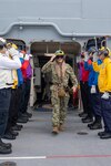 PHILIPPINE SEA (June 2, 2021) Vice Adm. Bill Merz, commander, U.S. 7th Fleet, departs the forward-deployed amphibious assault ship USS America (LHA 6). America, lead ship of the America Amphibious Ready Group, along with the 31st Marine Expeditionary Unit, is operating in the U.S. 7th Fleet area of operations to enhance interoperability with allies and partners and serve as a ready response force to defend peace and stability in the Indo-Pacific region.