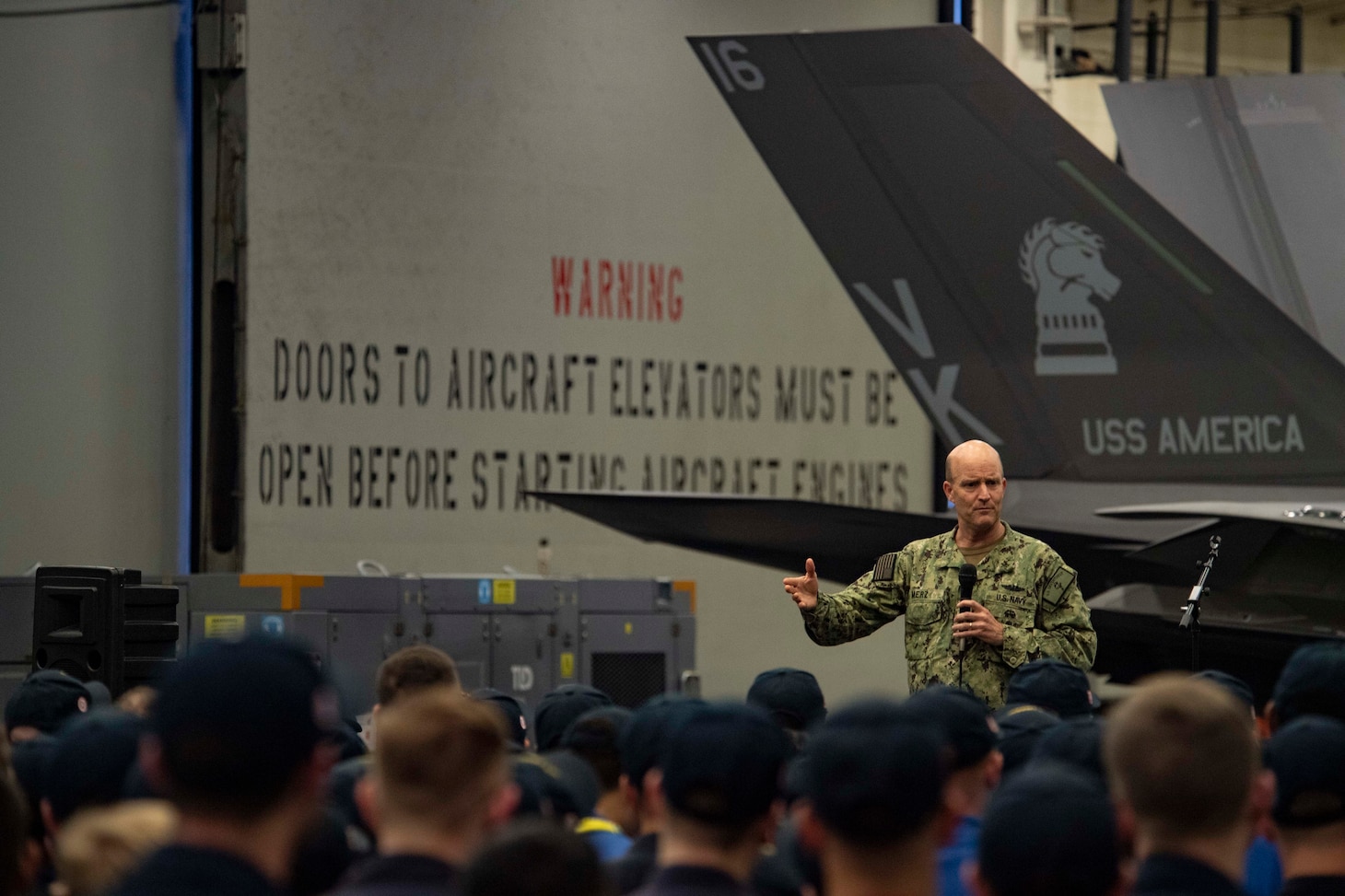 PHILIPPINE SEA (2 June, 2021) Vice Adm. Bill Merz, commander, U.S. 7th Fleet, addresses the crew of the forward-deployed amphibious assault ship USS America (LHA 6) during an admirals call. America, lead ship of the America Amphibious Ready Group, is operating in the U.S. 7th Fleet area of operations with the 31st Marine Expeditionary Unit, to enhance interoperability with allies and partners and serve as a ready response force to defend peace and stability in the Indo-Pacific region.