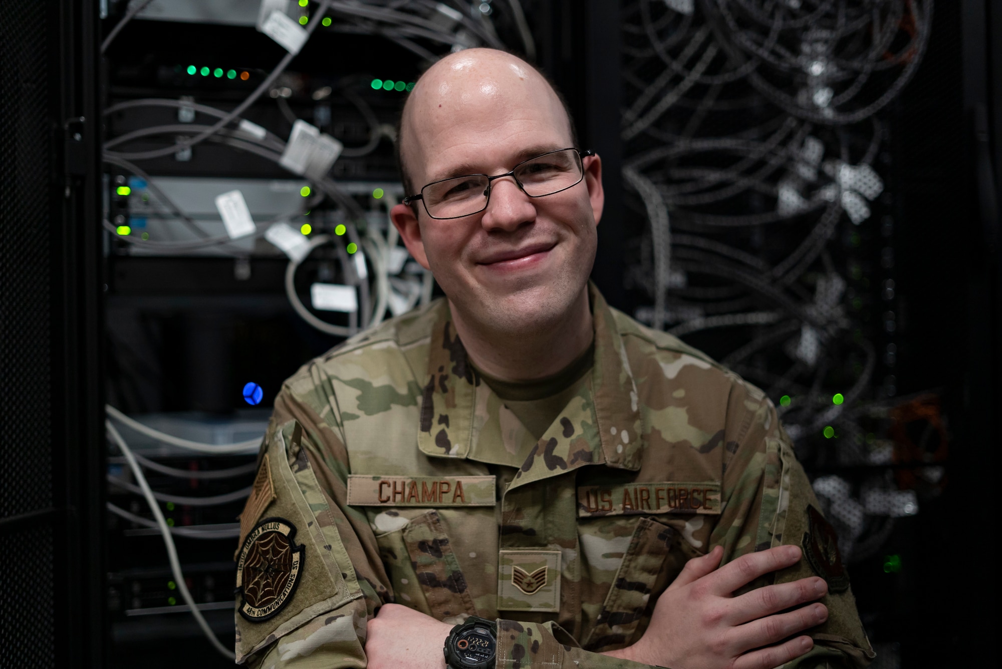 U.S. Air Force Staff Sgt. Edward Champa, 48th Communications Squadron cyber secure supervisor, sits in the server room at Royal Air Force Lakenheath, England, May 25, 2021. The 48th CS is responsible for the maintenance and care of millions of dollars worth of communications assets providing superior computer, data and voice capabilities to Royal Air Force Lakenheath and RAF Feltwell. (U.S. Air Force photo by Senior Airman Jessi Monte)