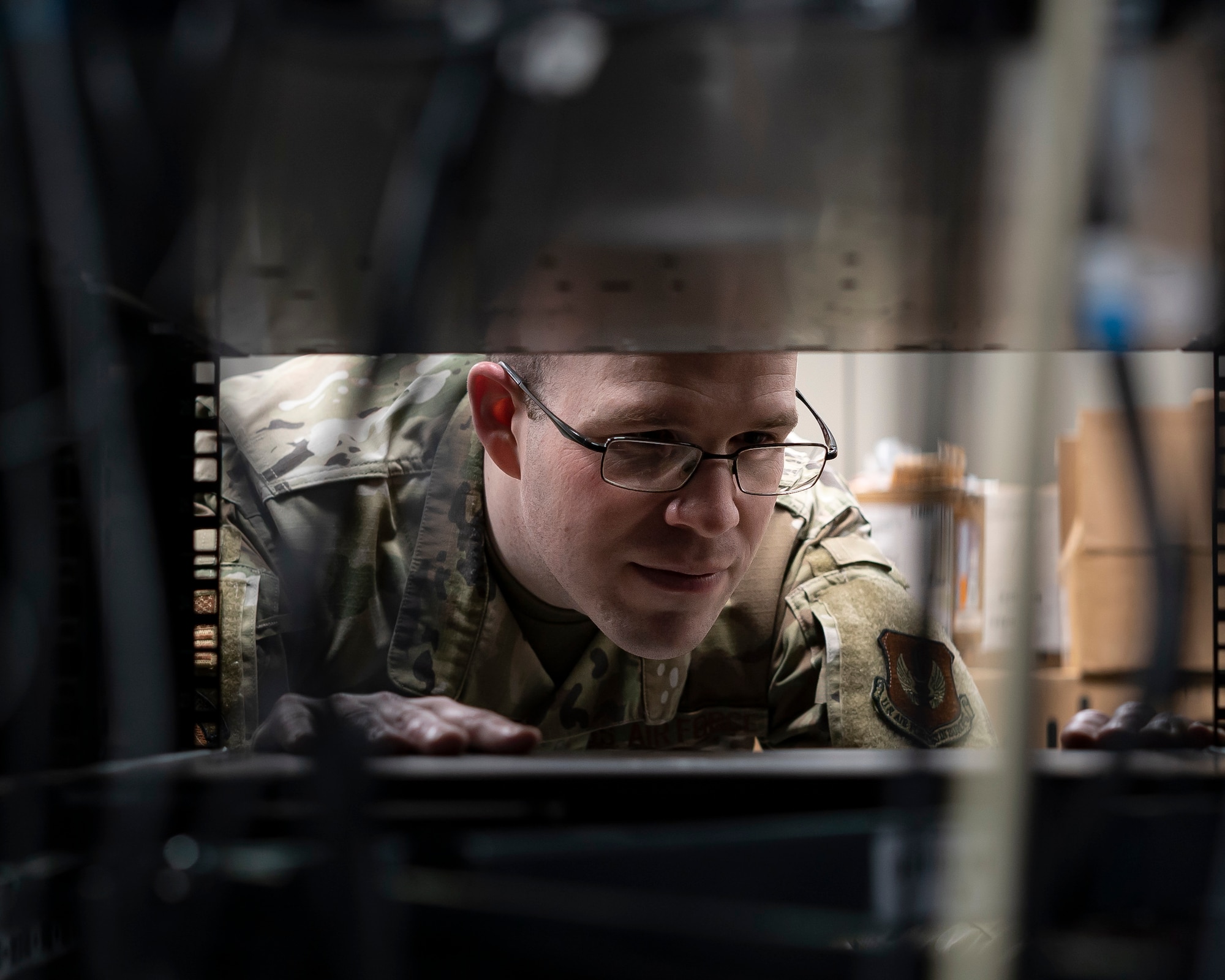 U.S. Air Force Staff Sgt. Edward Champa, 48th Communications Squadron cyber secure supervisor, works on a server at Royal Air Force Lakenheath, England, May 25, 2021. The 48th CS won the Lt. Gen. Harold W. Grant Award for best small communications squadron in the U.S. Air Force for the Oct. 1, 2019 to Sept. 30, 2020 time period. (U.S. Air Force photo by Senior Airman Jessi Monte)