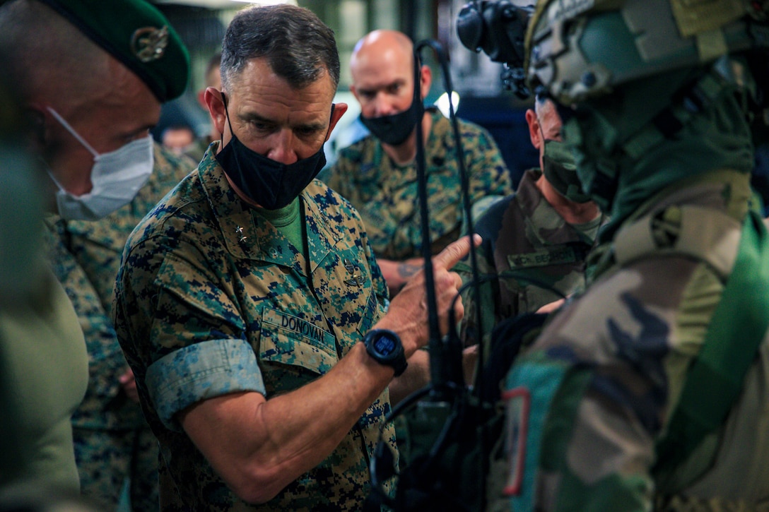 U.S. Marine Corps Maj. Gen. Francis Donovan, the commanding general of 2d Marine Division, engages with soldiers from the French Army aboard amphibious helicopter carrier Dixmude, May 31, 2021. Donovan’s visit to France included engagements with key leaders to strengthen relationships with the French Armed Forces in order to refine interoperability for future cooperation. (U.S. Marine Corps photo by Sgt. Margaret Gale)