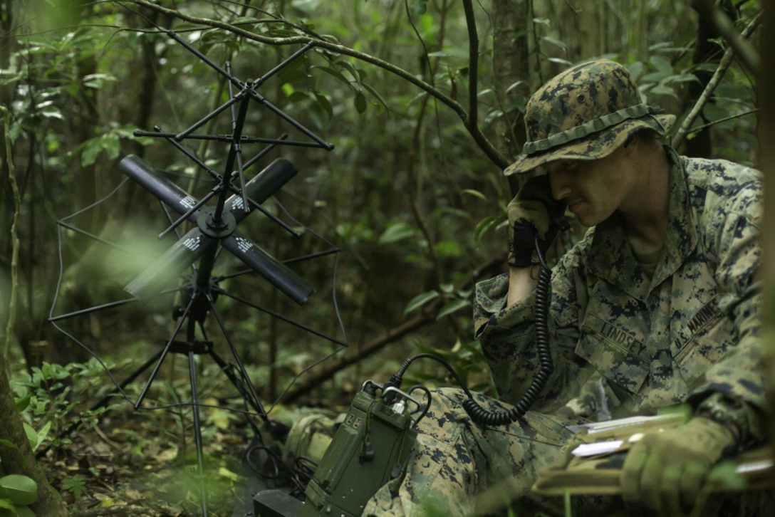 U.S. Marine Corps Cpl. Tyler Lindsey, a ground electronics telecommunications Marine with 2d Battalion, 2d Marines, conducting a radio check during Jungle Warfare Exercise in the Northern Training Area on Okinawa, Japan, May 25, 2021. This unscripted force-on-force exercise tested and strengthened the Marines’ ability to operate within distributed jungle and littoral environments, while adapting to a thinking peer-level adversary. 2/2 is forward-deployed in the Indo-Pacific under 4th Marines, 3d Marine Division, as a part of the Unit Deployment Program. Lindsey is a native of Atlanta, Georgia. (U.S. Marine Corps Photo by Lance Cpl. Scott Aubuchon)
