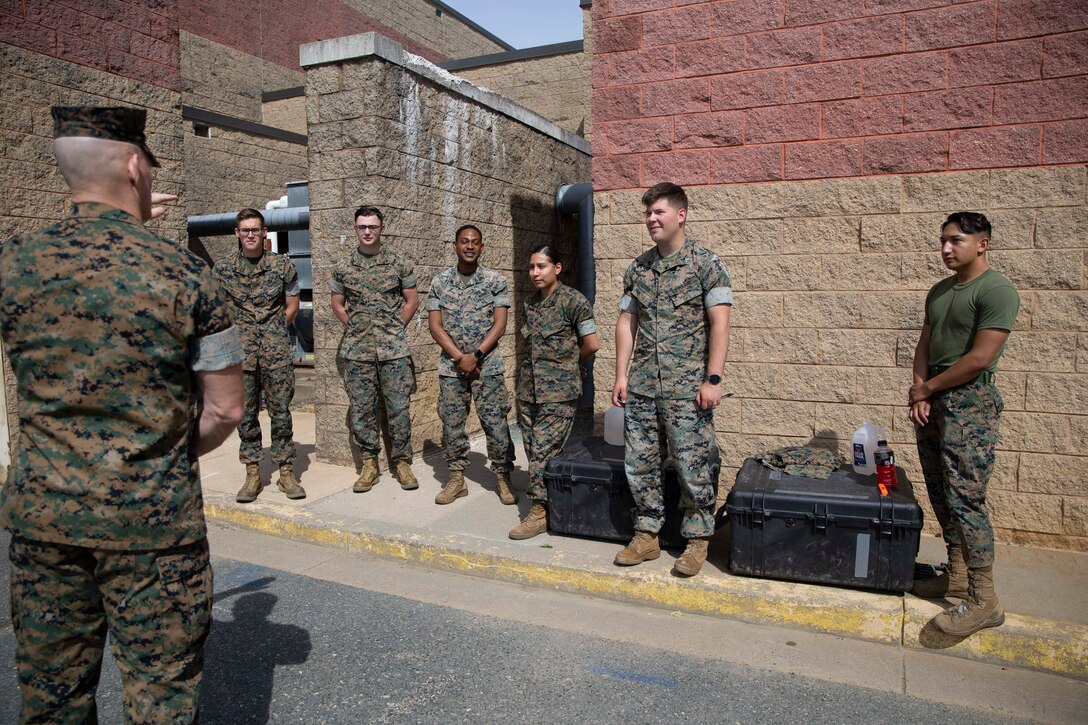 The 19th Sergeant Major of the Marine Corps, Sgt. Maj. Troy E. Black, greets Marines at The Basic School (TBS), Triangle, Va, June 3, 2021. The Sergeant Major of the Marine Corps spoke to the Marines that man the supporting establishment at TBS and toured their work sections. The supporting units ensure that Marine Corps officers training at TBS are taught the basics skills to effectively lead as a Marine Officer. (U.S. Marine Corps photo by Sgt. Victoria Ross)