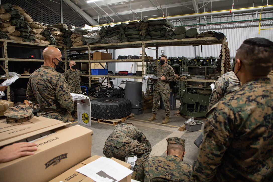 U.S. Marine Corps Capt. Adam Devine, a company commander with 2nd Transportation Battalion, gives a pre-convoy brief to Marines on Camp Lejeune, North Carolina, May 1, 2021. Marines with 2nd Transportation Battalion, Combat Logistics Regiment 2, 2nd Marine Logistics Group conducted a convoy across the United States starting in Camp Lejeune, North Carolina and arriving at Marine Corps Air Ground Combat Center Twentynine Palms, California, in on of the longest convoys in recent Marine Corps history. (U.S. Marine Corps photo by Lance Cpl. Scott Jenkins)