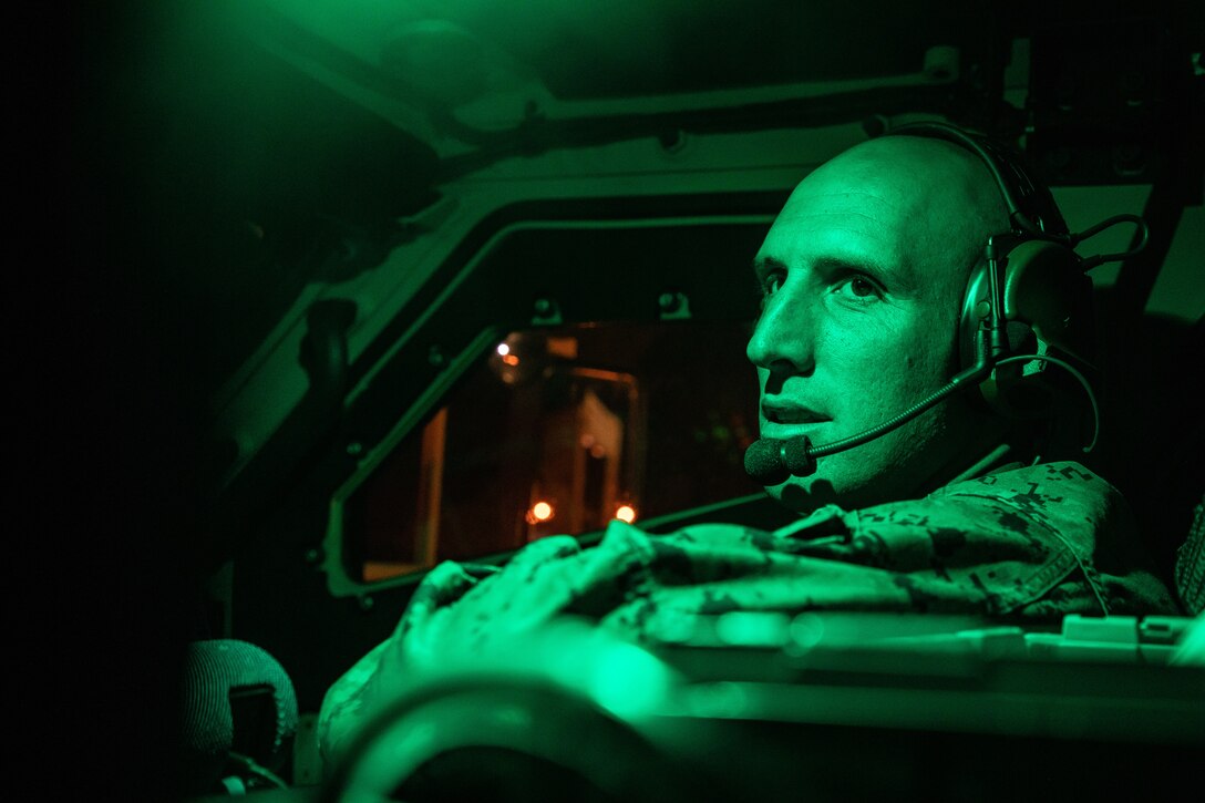 U.S. Marine Corps Staff Sgt. Coltin Davenport, regimental communications chief, sits in a joint light tactical vehicle on Naval Support Activity Mid-South, Tennessee, May 6, 2021. Marines with 2nd Transportation Battalion, Combat Logistics Regiment 2, 2nd Marine Logistics Group conducted a convoy across the United States starting in Camp Lejeune, North Carolina and arriving at Marine Corps Air Ground Combat Center Twentynine Palms, California, in on of the longest convoys in recent Marine Corps history. (U.S. Marine Corps photo by Lance Cpl. Scott Jenkins)