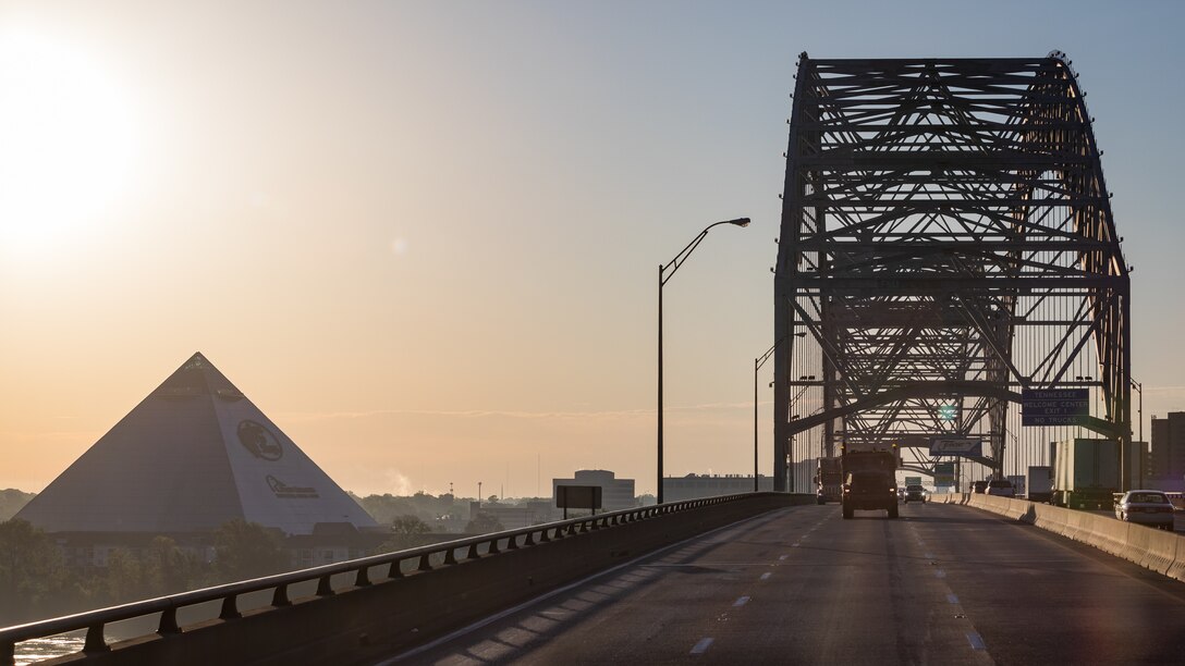 U.S. Marines drive tactical vehicles over the Mississippi River, near Memphis, Tennessee, May 6,2021. Marines with 2nd Transportation Battalion, Combat Logistics Regiment 2, 2nd Marine Logistics Group conducted a convoy across the United States starting in Camp Lejeune, North Carolina and arriving at Marine Corps Air Ground Combat Center Twentynine Palms, California, in on of the longest convoys in recent Marine Corps history. (U.S. Marine Corps photo by Lance Cpl. Scott Jenkins)