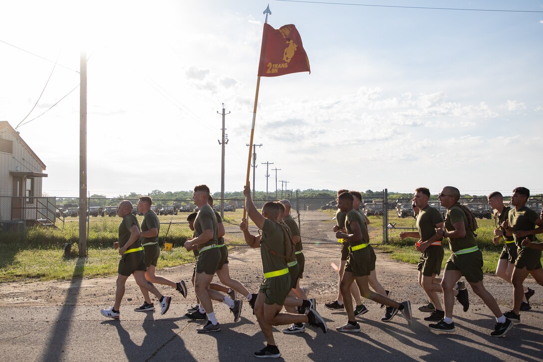 U.S. Marines on a company run at Fort Chaffee, Arkansas, May 8, 2021. Marines with 2nd Transportation Battalion, Combat Logistics Regiment 2, 2nd Marine Logistics Group conducted a convoy across the United States starting in Camp Lejeune, North Carolina and arriving at Marine Corps Air Ground Combat Center Twentynine Palms, California, in on of the longest convoys in recent Marine Corps history. (U.S. Marine Corps photo by Lance Cpl. Scott Jenkins)