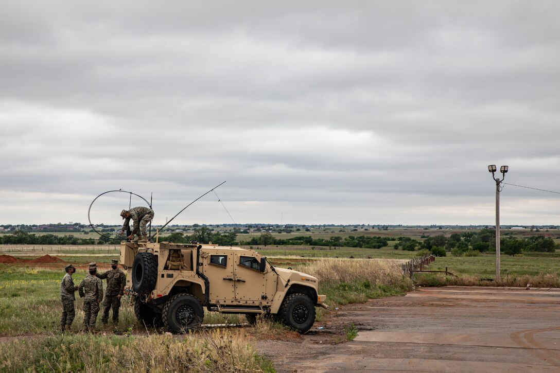 U.S. Marines set up a high frequency radio near Amarillo, Texas, May 10, 2021. Marines with 2nd Transportation Battalion, Combat Logistics Regiment 2, 2nd Marine Logistics Group conducted a convoy across the United States starting in Camp Lejeune, North Carolina and arriving at Marine Corps Air Ground Combat Center Twentynine Palms, California, in on of the longest convoys in recent Marine Corps history. (U.S. Marine Corps photo by Lance Cpl. Scott Jenkins)