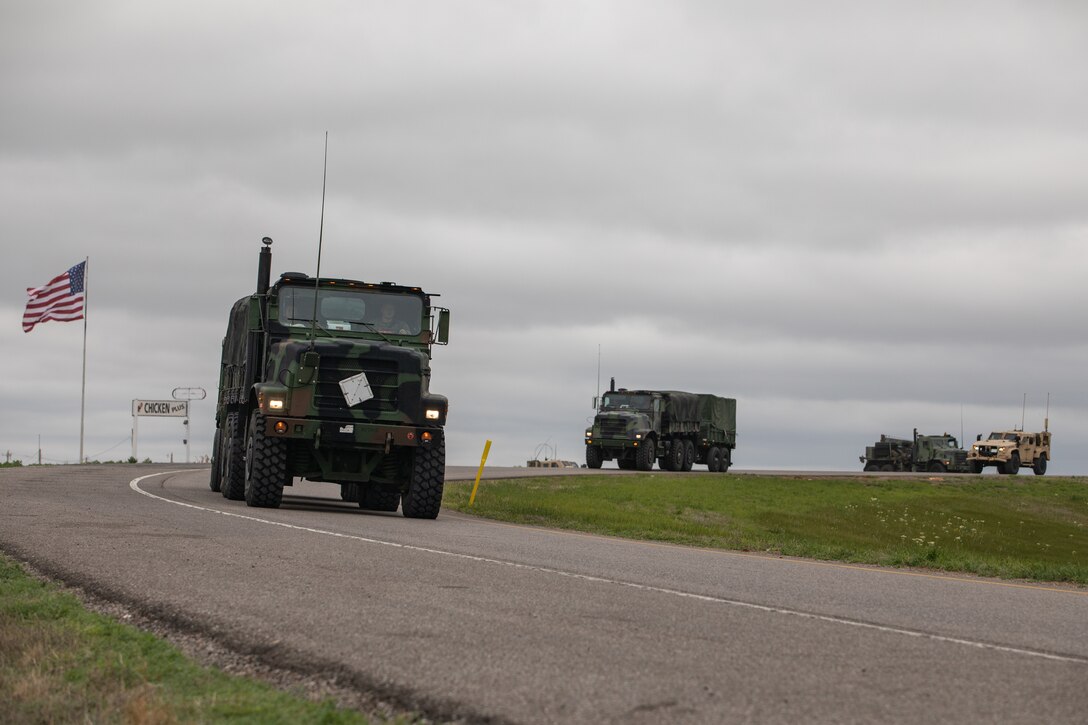 U.S. Marines drive tactical vehicles onto the highway near Amarillo, Texas, May 10, 2021. Marines with 2nd Transportation Battalion, Combat Logistics Regiment 2, 2nd Marine Logistics Group conducted a convoy across the United States starting in Camp Lejeune, North Carolina and arriving at Marine Corps Air Ground Combat Center Twentynine Palms, California, in on of the longest convoys in recent Marine Corps history. (U.S. Marine Corps photo by Lance Cpl. Scott Jenkins)