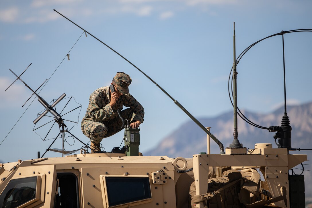 U.S. Marine Corps Cpl. Owen Trinidad, a radio operator, gets a radio check at Kirtland Air Force Base, May 11, 2021. Marines with 2nd Transportation Battalion, Combat Logistics Regiment 2, 2nd Marine Logistics Group conducted a convoy across the United States starting in Camp Lejeune, North Carolina and arriving at Marine Corps Air Ground Combat Center Twentynine Palms, California, in on of the longest convoys in recent Marine Corps history. (U.S. Marine Corps photo by Lance Cpl. Scott Jenkins)