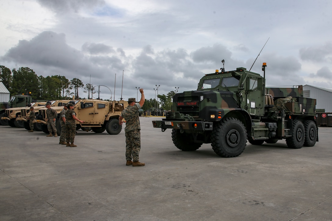 U.S. Marines stage vehicles on Camp Lejeune, North Carolina, June 3, 2021. Marines with 2nd Transportation Battalion, Combat Logistics Regiment 2, 2nd Marine Logistics Group conducted a convoy across the United States starting in Camp Lejeune, North Carolina, in one of the longest convoys in recent Marine Corps history. Marines on the convoy experimented with long-range communications, as far away as Marine Corps Air Ground Combat Center Twentynine Palms, California, the half-way point on the route. (U.S. Marine Corps photo by Cpl. Christian M. Garcia)