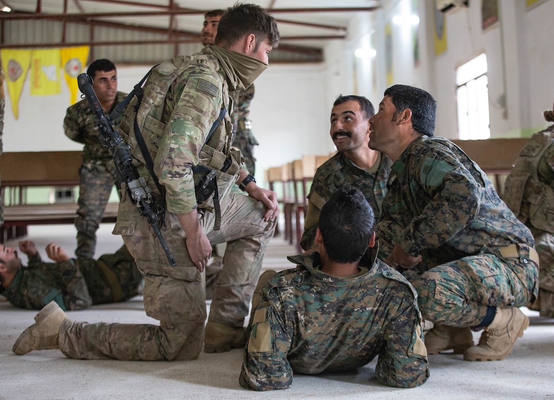American and Syrian medics practice medical techniques.