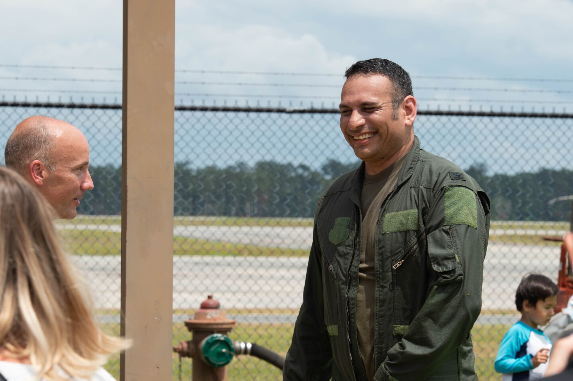 A photo of an Airman smiling.